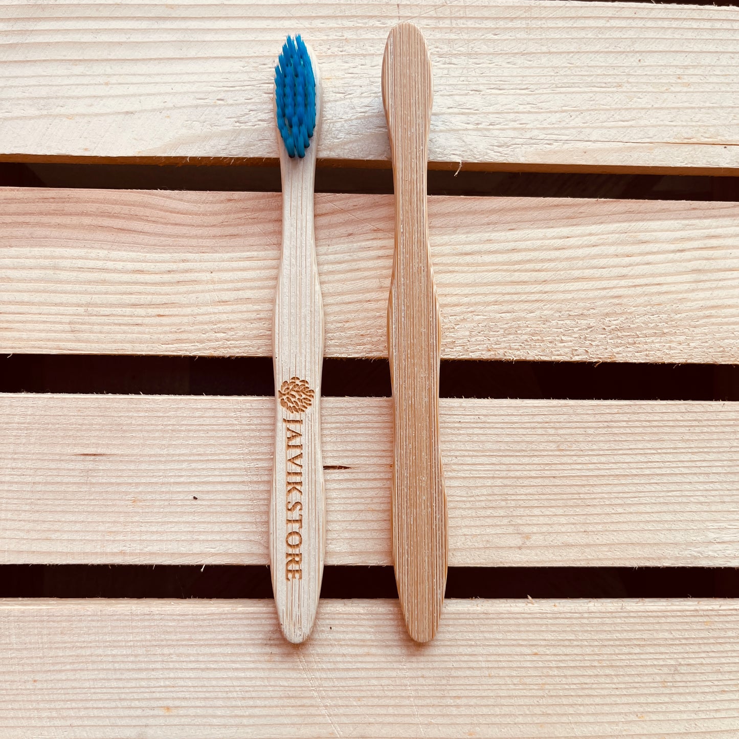 Front and back view of Jaivik Store Bamboo Toothbrush for Kids, Curvy Blue – Biodegradable with a soft bristle design