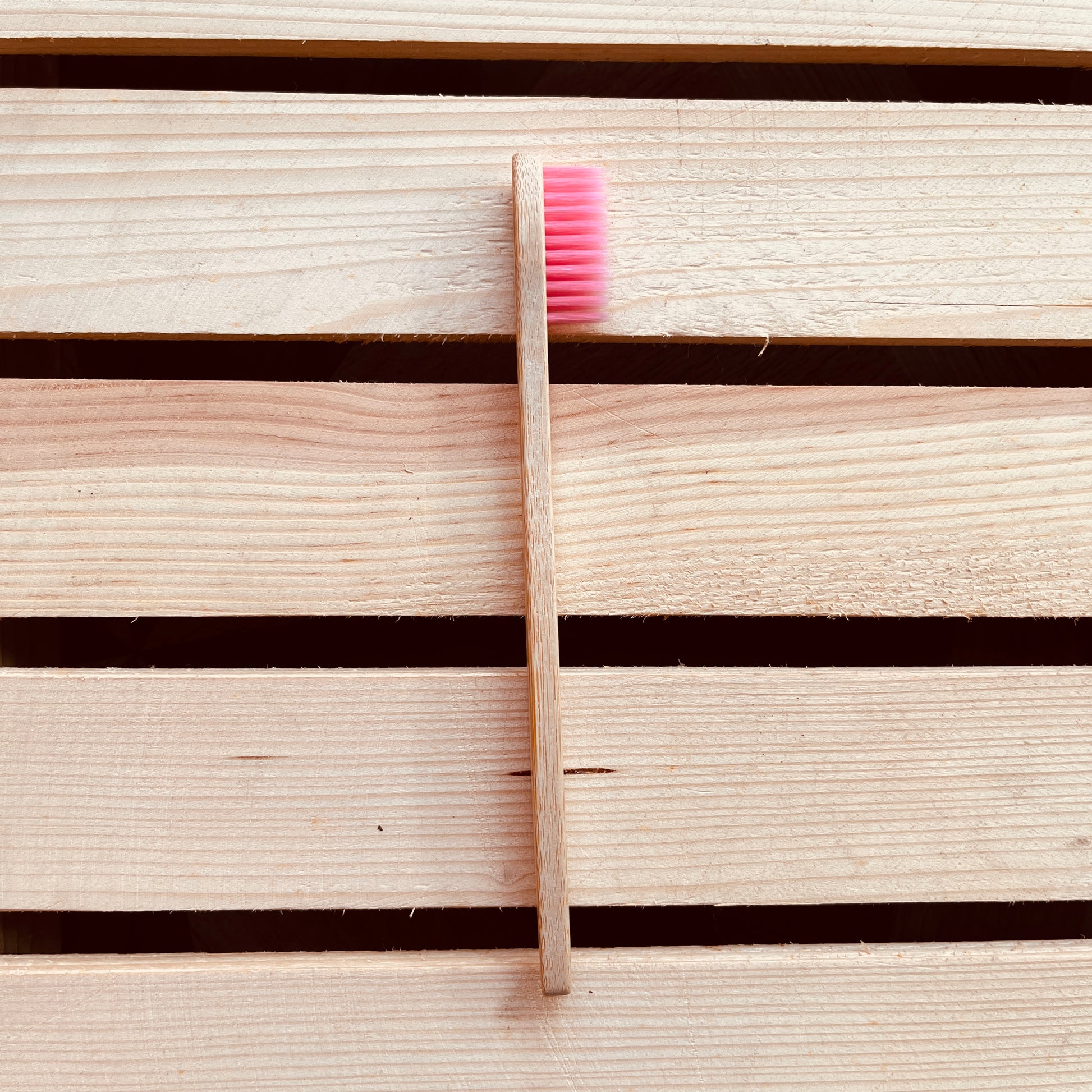 Side view of Jaivik Store Bamboo Toothbrush for Kids, Round Pink – Biodegradable, soft bristles, and round handle design