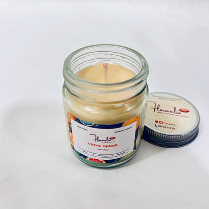 Close-up of Jaivik Store Citrus Splash scented soy wax jar candle, 100g, with lid open and wick visible for premium detail