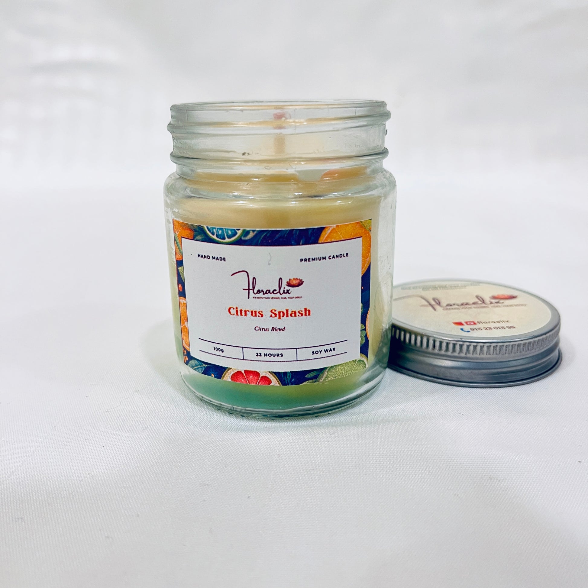 Jaivik Store Citrus Splash scented soy wax jar candle, 100g, front view with lid open, highlighting eco-friendly elegance