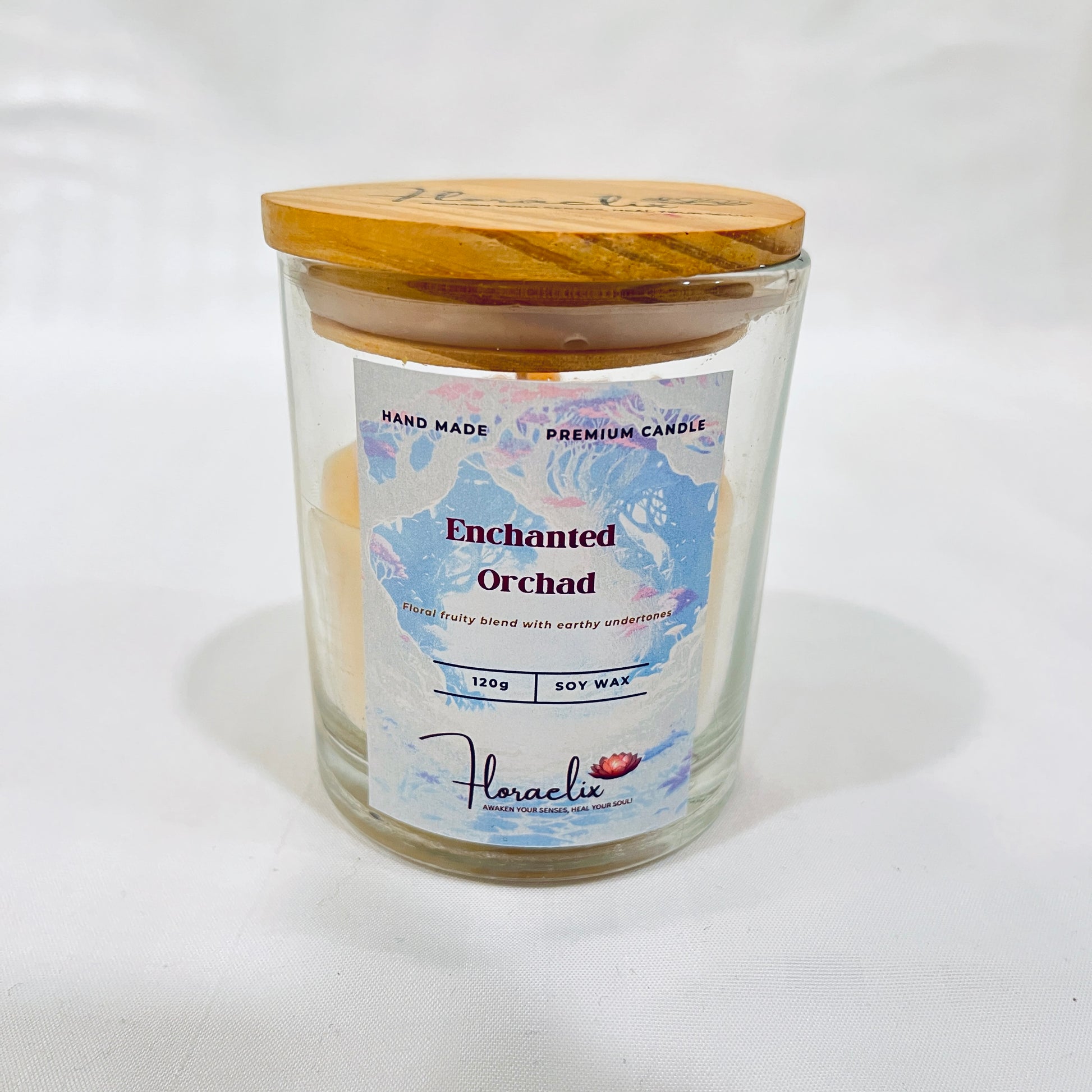 Front view of Jaivik Store Enchanted Orchard Daisy soy wax candle, 120g, lid closed, eco-friendly and premium