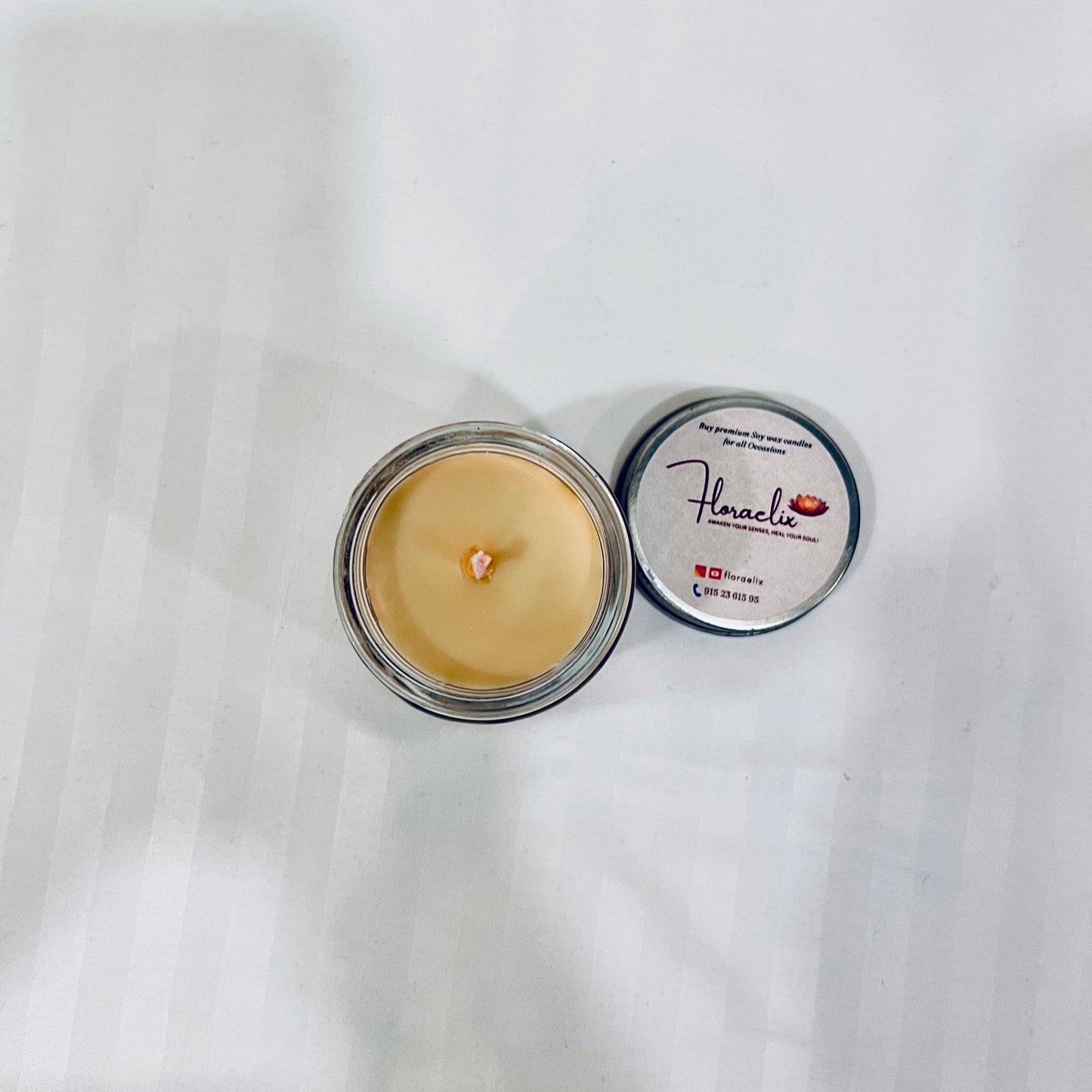 Top view of Jaivik Store Joy of the Wood soy wax candle, 100g, lid open, revealing a smooth wax surface