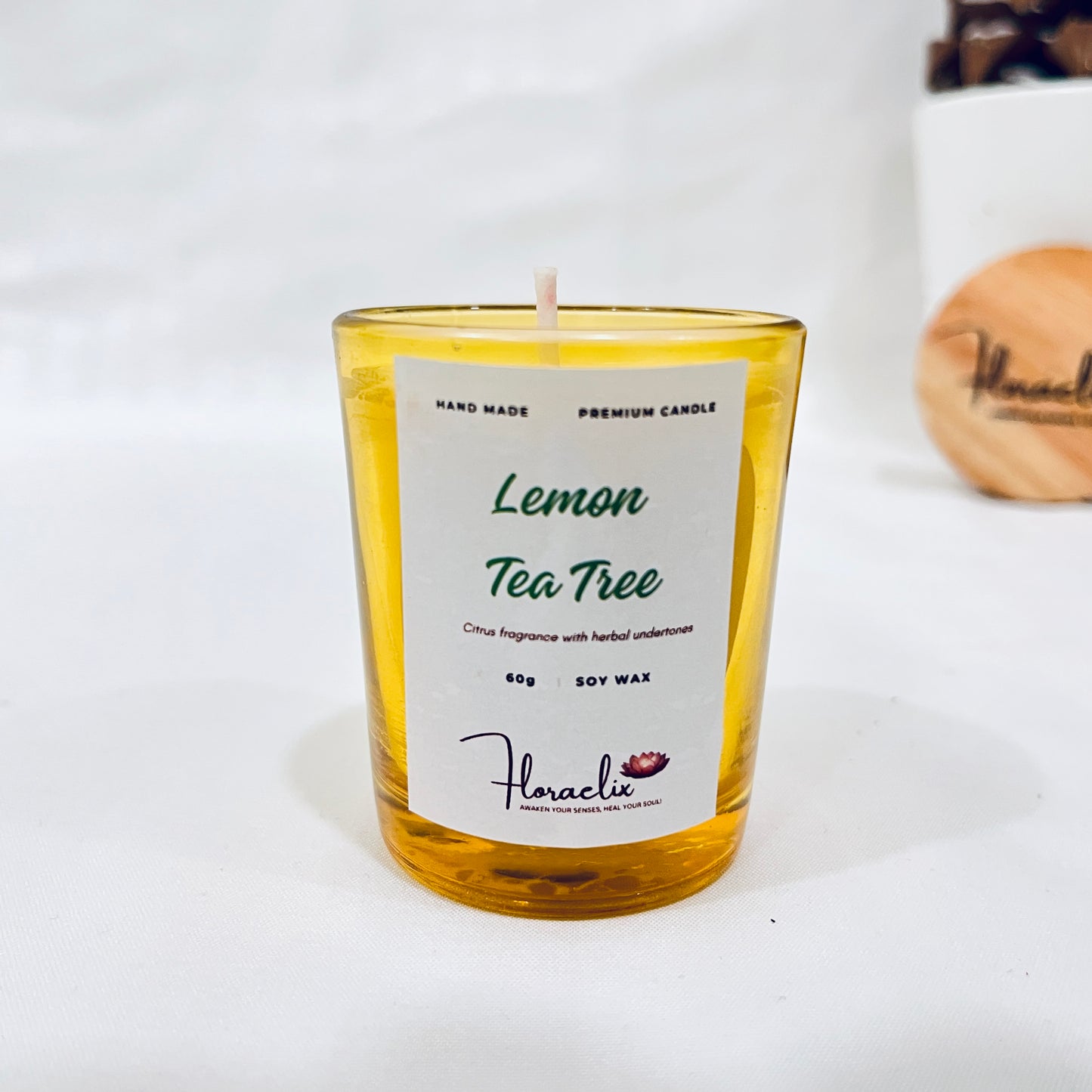 Front view of Jaivik Store Energizing Lemon & Tea Tree soy wax candle for aromatherapy, 60g, eco-friendly and vibrant design