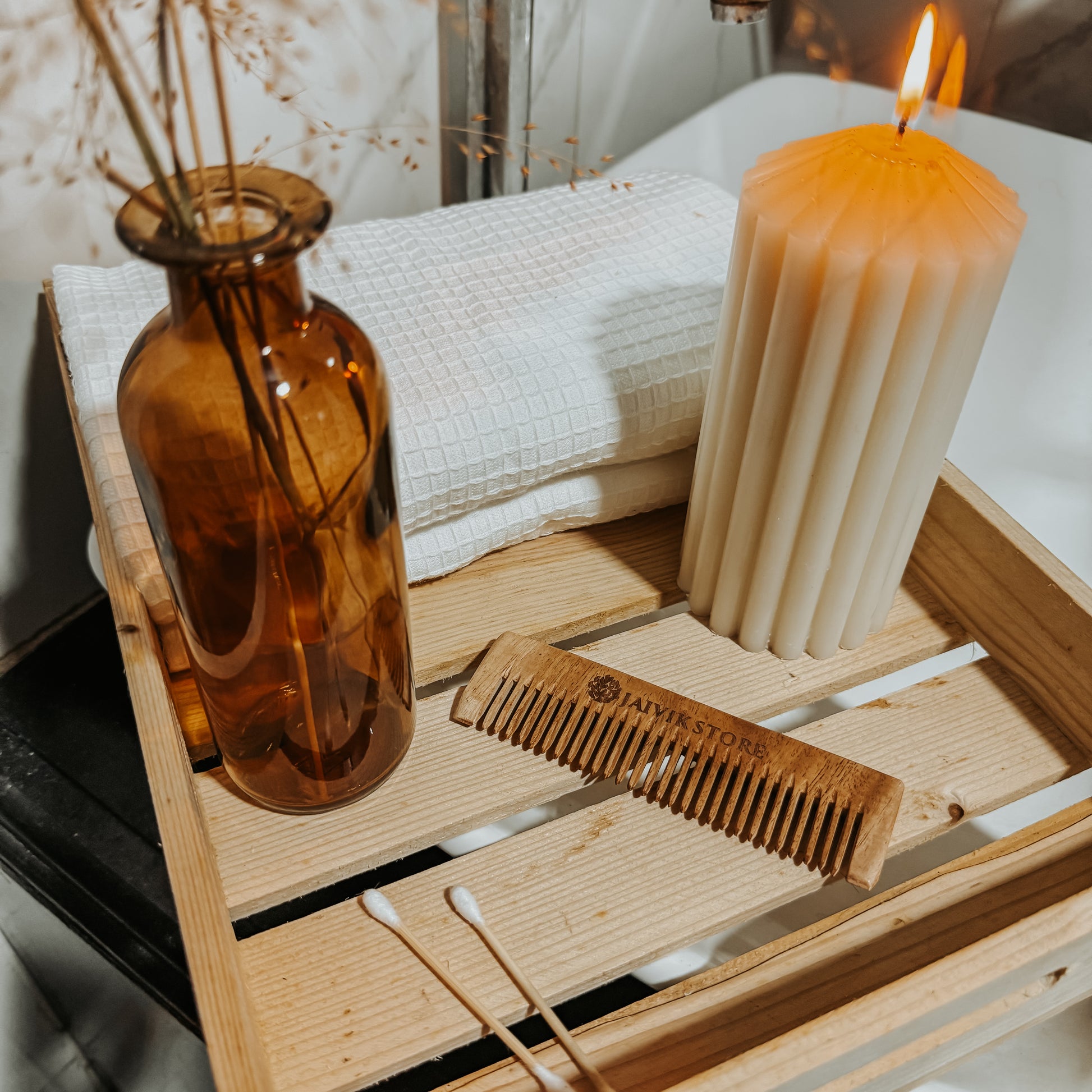 Jaivik Store Neem Wooden Comb for Kids - Pocket Comb Design Displayed with Wooden Tray, Candle, Towel, and Dry Flowers